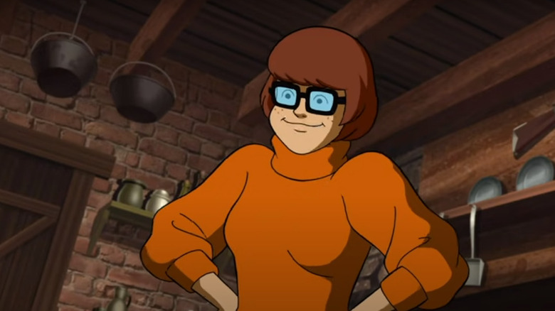 Velma greets Shaggy and Scooby