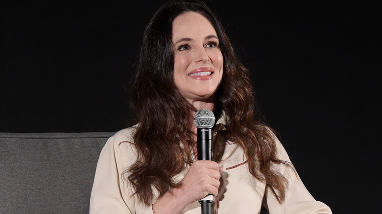 Madeleine Stowe holds a microphone