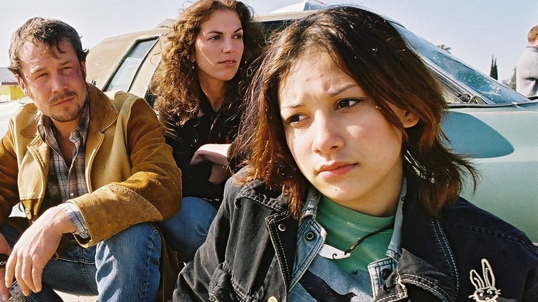 Ethan, Vicky, and Norma around a car