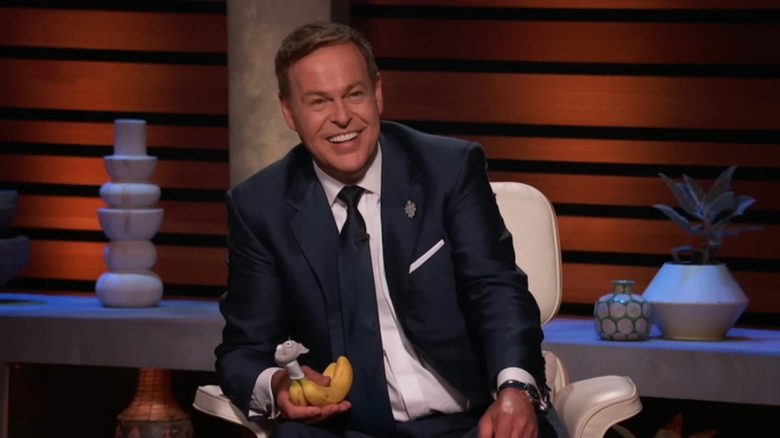 Peter Jones holds banana with Nana Hat