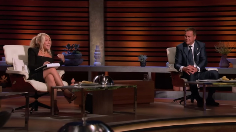 Lori Greiner and Peter Jones sitting on Shark Tank