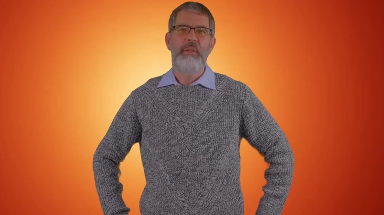 Andy Scherer against orange background