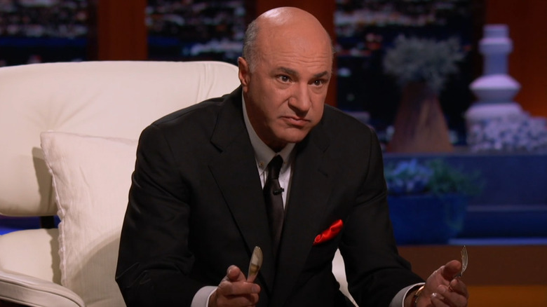 Kevin O'Leary holding fork and knife