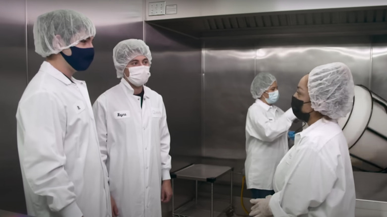 Nick Hamburger and Zack Schreier standing in production facility