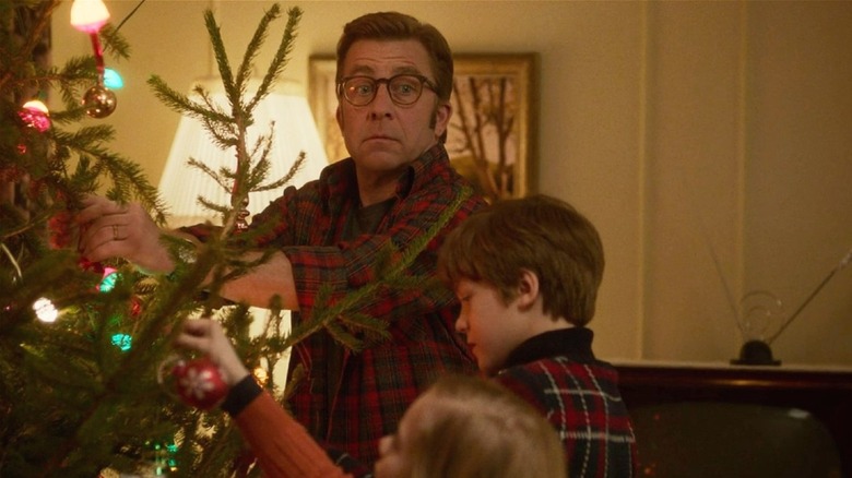 Ralphie hanging ornaments with kids