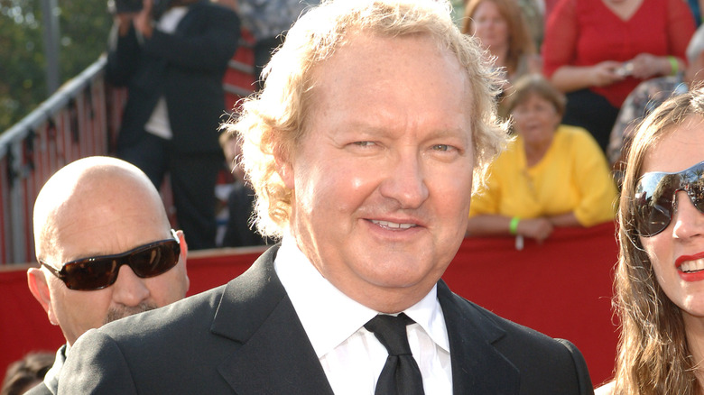 Randy Quaid wearing suit