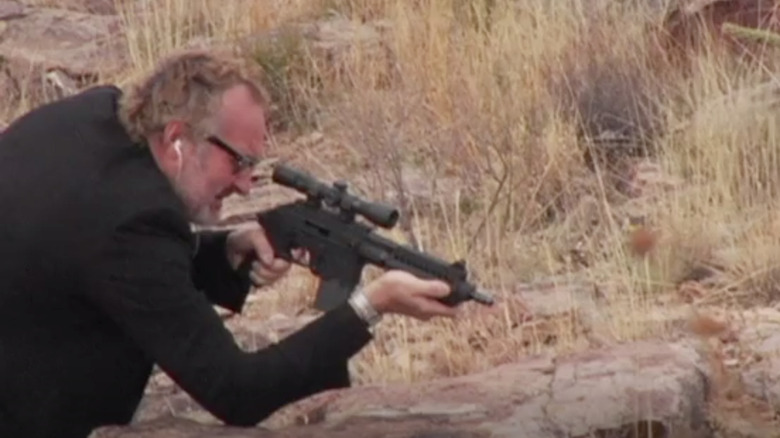 Randy Quaid shooting gun