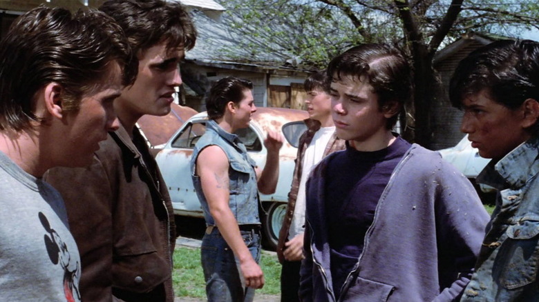 Two-Bit, Dallas, Ponyboy, and Johnny talking