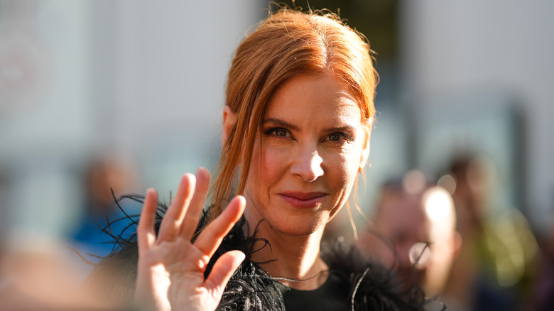 Sarah Rafferty waving at camera