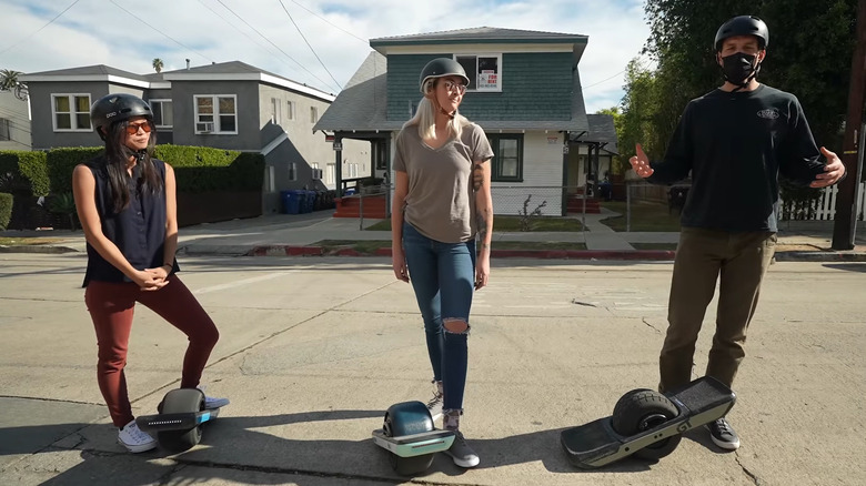 Three Onewheel Riders