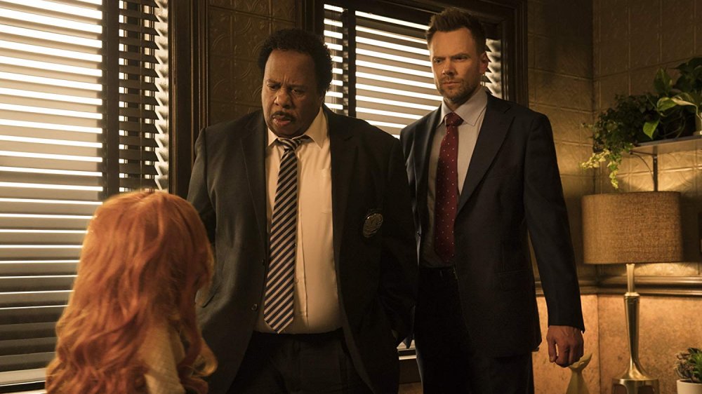 Leslie David Baker and Joel McHale in The Happytime Murders