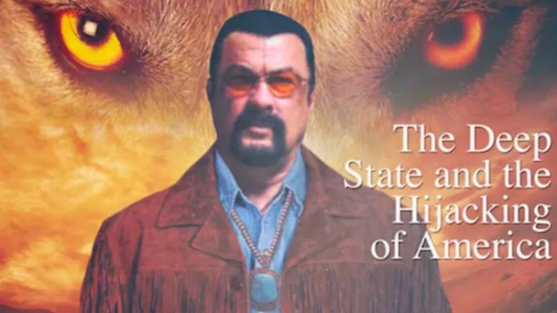 Steven Seagal stands in front of wolf eyes