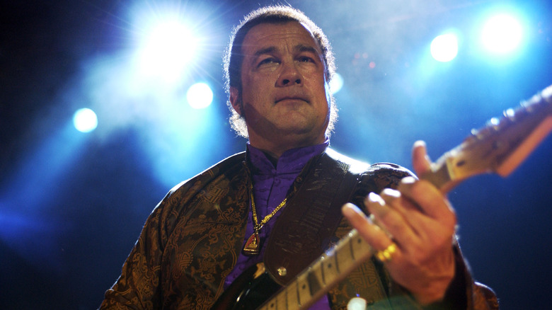 Steven Seagal playing guitar