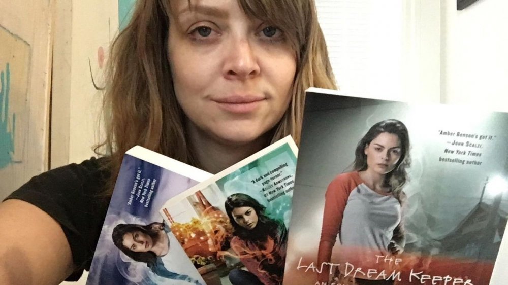 Amber Benson showing off her books