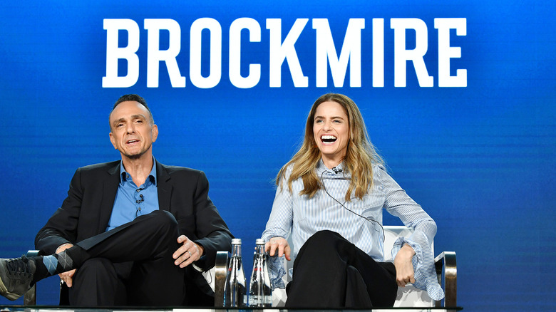 Hank Azaria and Amanda Peet talking at event