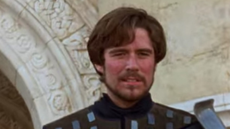 Alexis Denisof stands in armor 