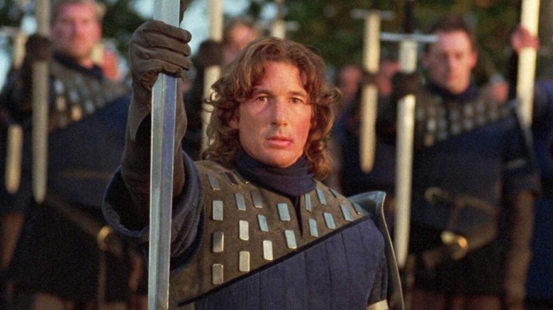 Richard Gere holds up sword