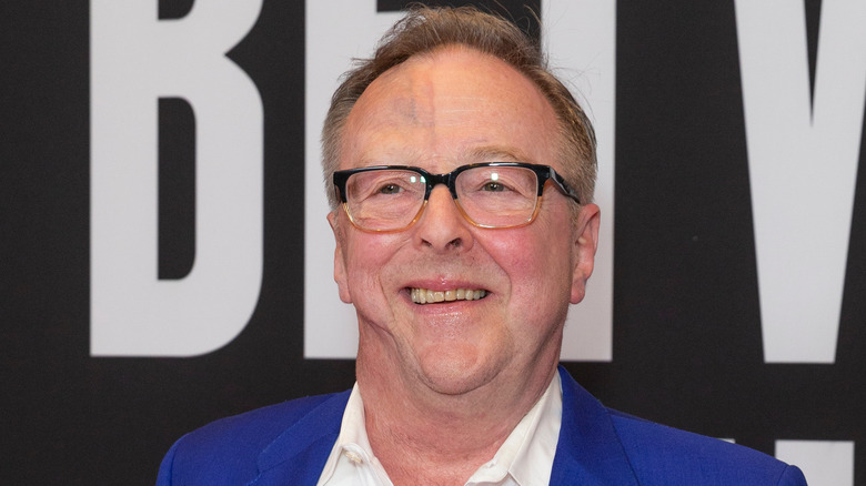 Edward Hibbert smiles