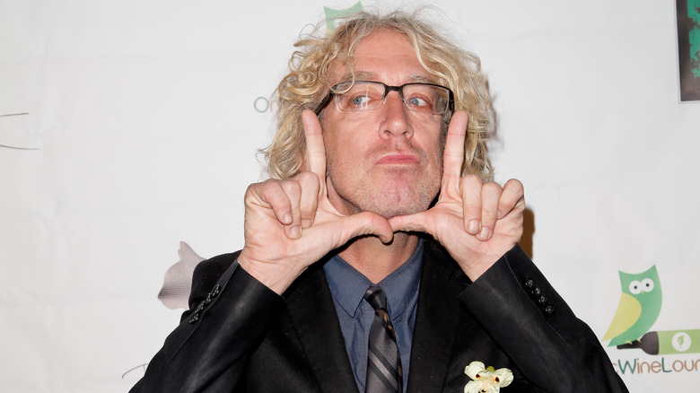 Andy Dick frames face with fingers