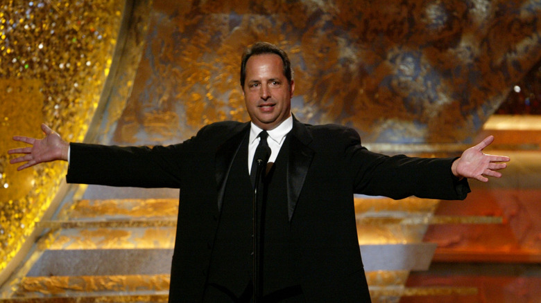 Jon Lovitz arms outstretched 