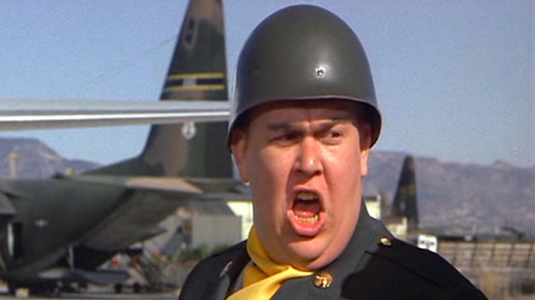 John Candy turns right, shouts