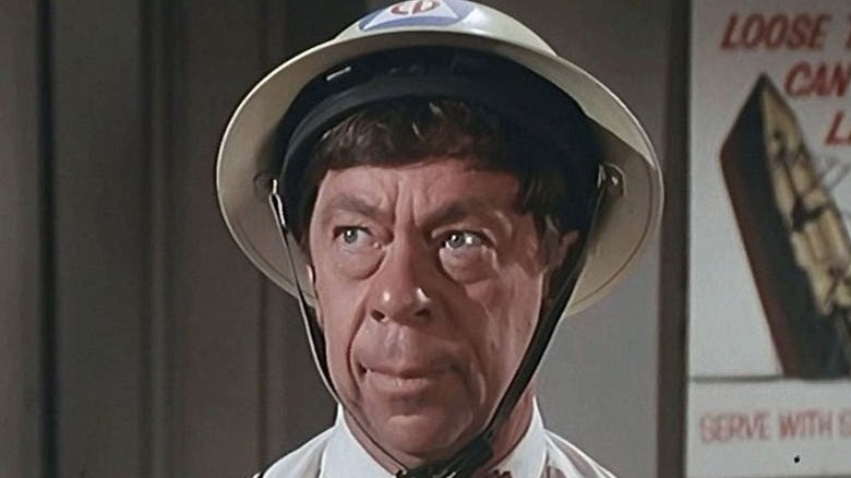 Joe Conley wear a Civil Defense warden helmet