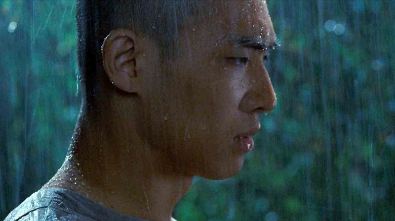 Raizo standing in the rain