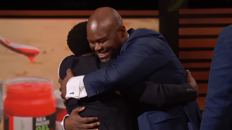 Alexiou hugging Kevin Hart