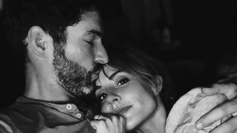 Tom Ellis and Meaghan Oppenheimer snuggle