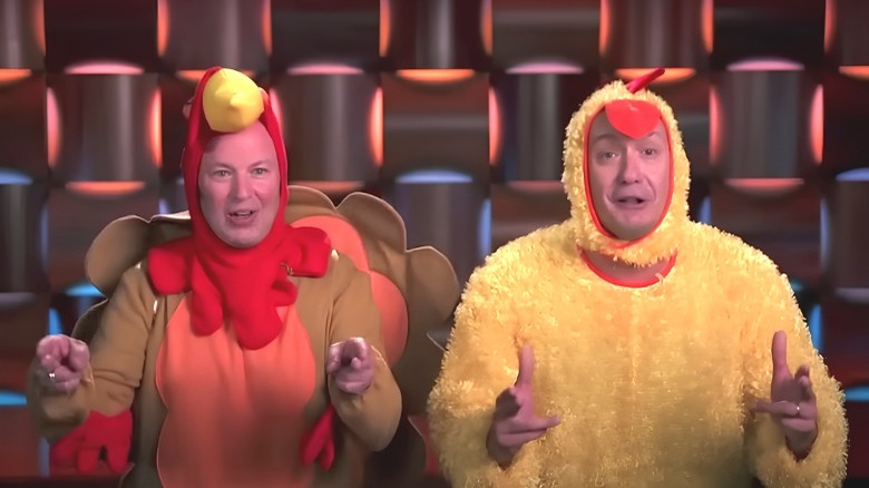 Kirk Hyust and Brian Halasinski pointing in bird costumes