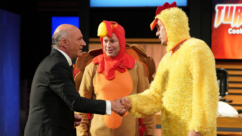 Kevin O'Leary shaking hands with Turbo Trusser founders