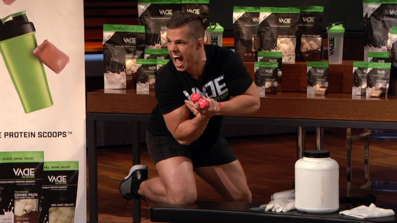 Joe lifting weights on Shark Tank