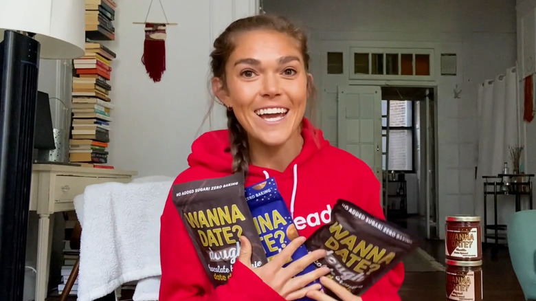 Melissa Bartow holds Wanna Date products