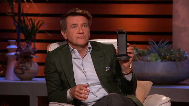 Robert Herjavec holds XTorch