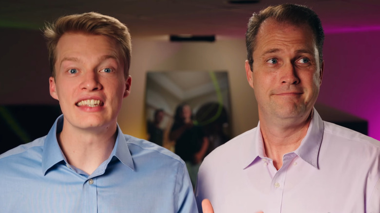 Austin Hillam smiling big, dad Mark Hillam looking to the right