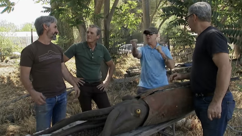 Mike and Robbie Wolfe in front of giant squid