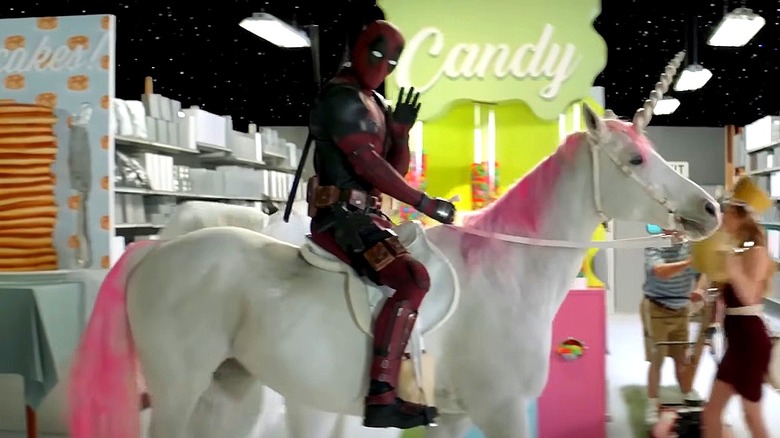 Deadpool riding a unicorn