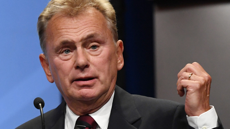 Pat Sajak speaking into a microphone