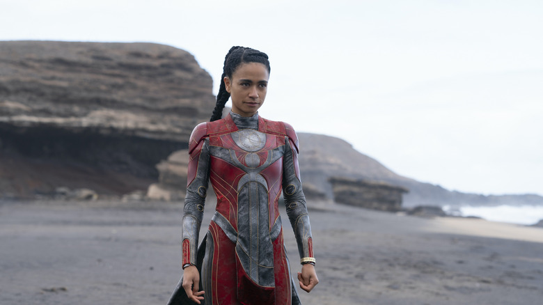 Lauren Ridloff standing on a beach as Makkari in Eternals