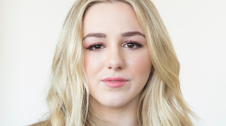 Chloe Lukasiak poses at the Noor presentation at New York Fashion Week in 2018