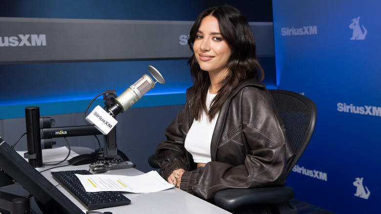 Mackenzie Ziegler smiles while sitting at the Sirius XM Studio