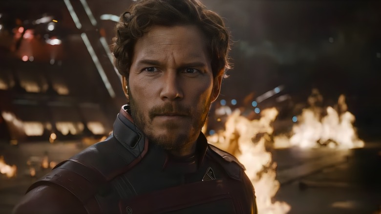 Peter Quill standing in front of flames