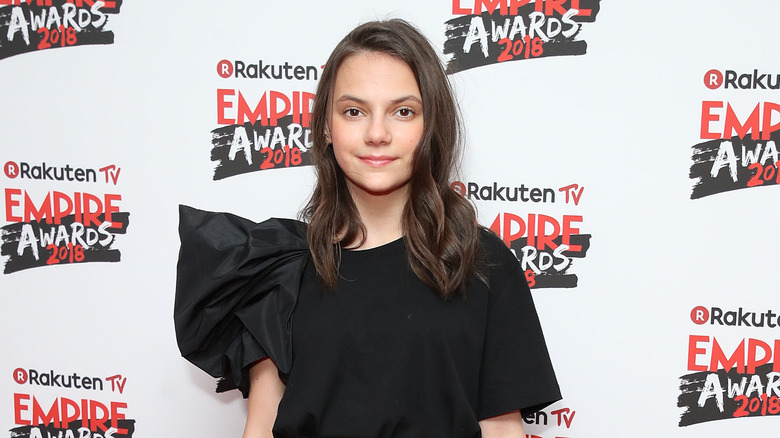 Dafne Keen posing for photos