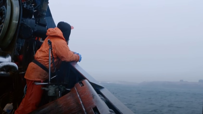 Deckhand looking at islands