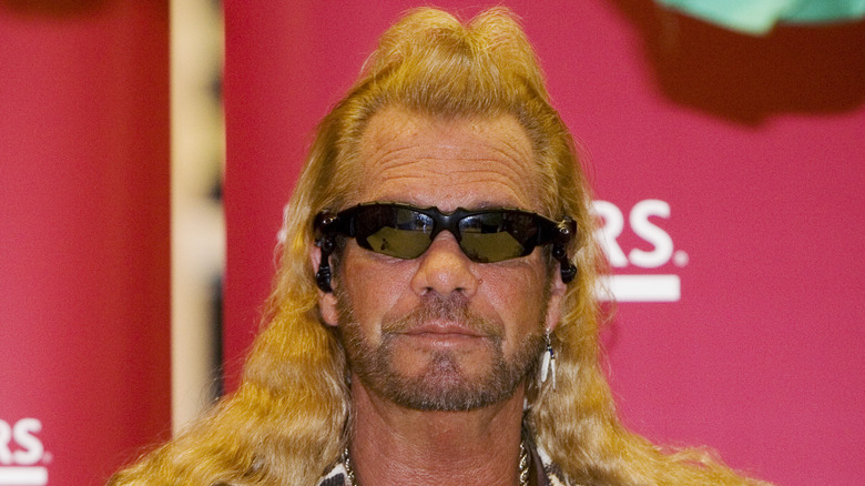 dog the bounty hunter sunglasses with bangs pulled up