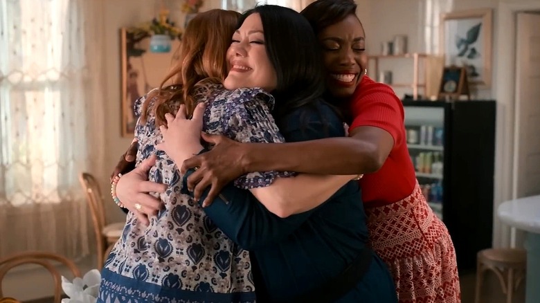 Maddie, Dana Sue, and Helen hugging each other