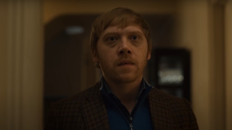 Rupert Grint looks serious