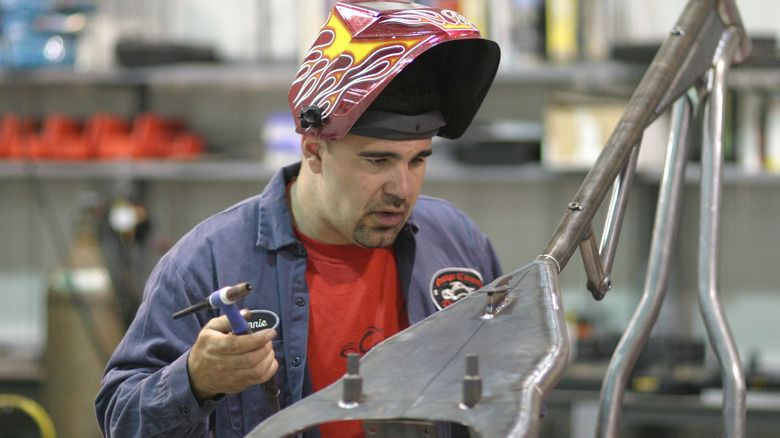 Vinnie DiMartino working on motorcycle