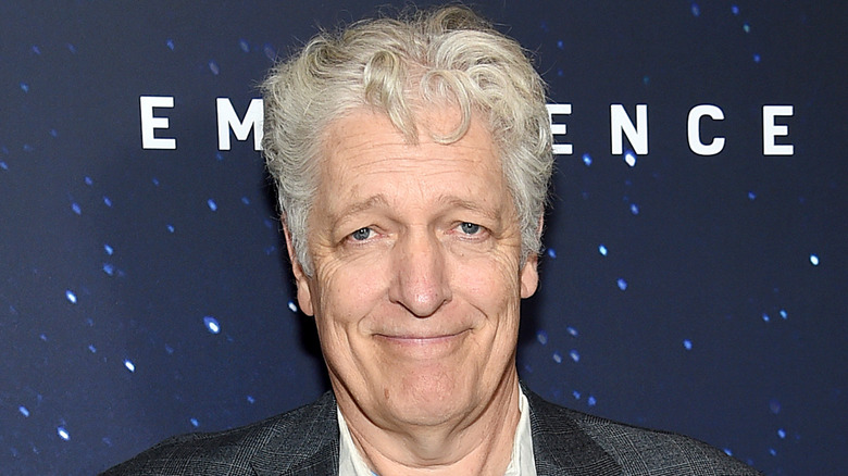 Clancy Brown smiles