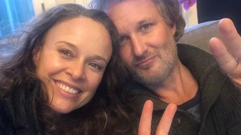 Tami Stronach and Greg Steinbruner make peace sign